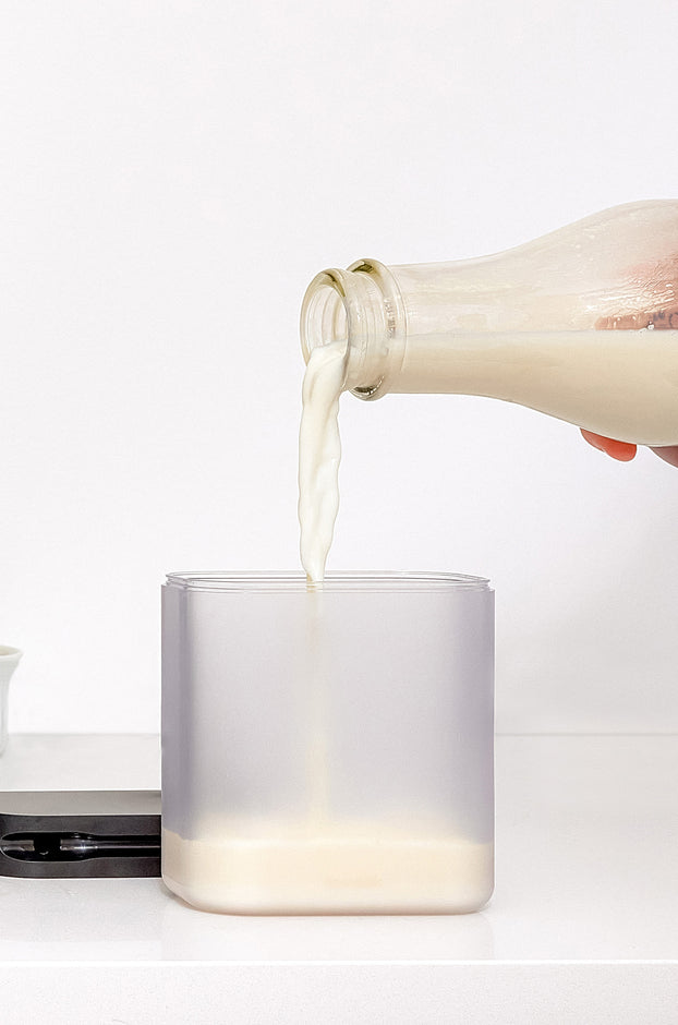 A Person re-filling the Milk Carafe of the TK-02