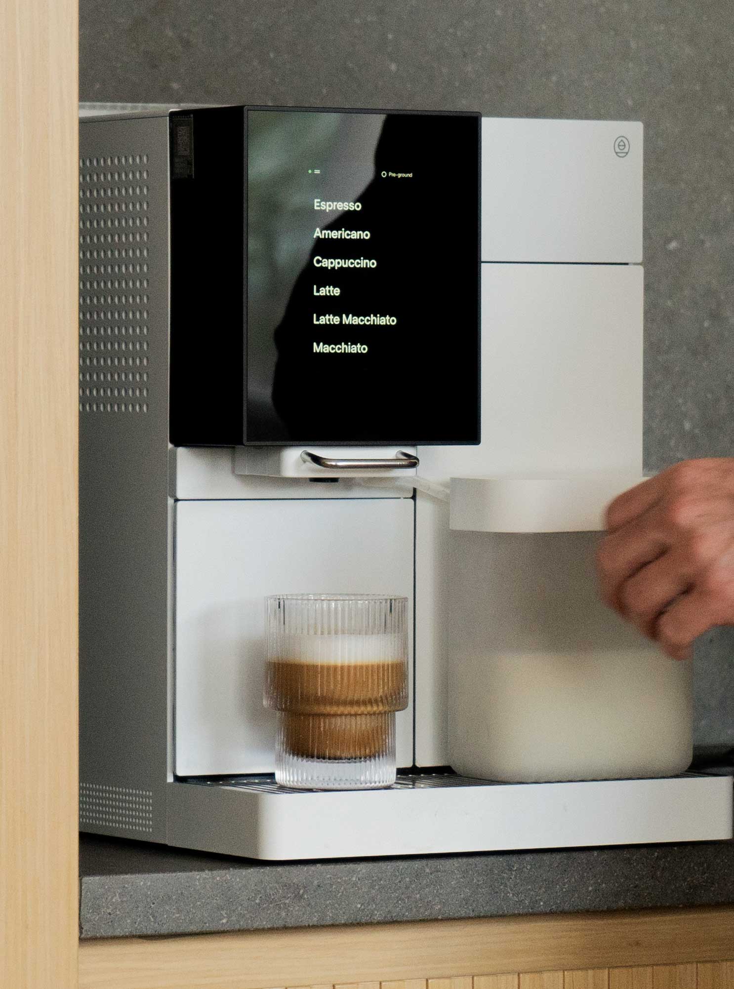 Terra Kaffe | Person about to grab a cappuccino from TK-02 drip tray