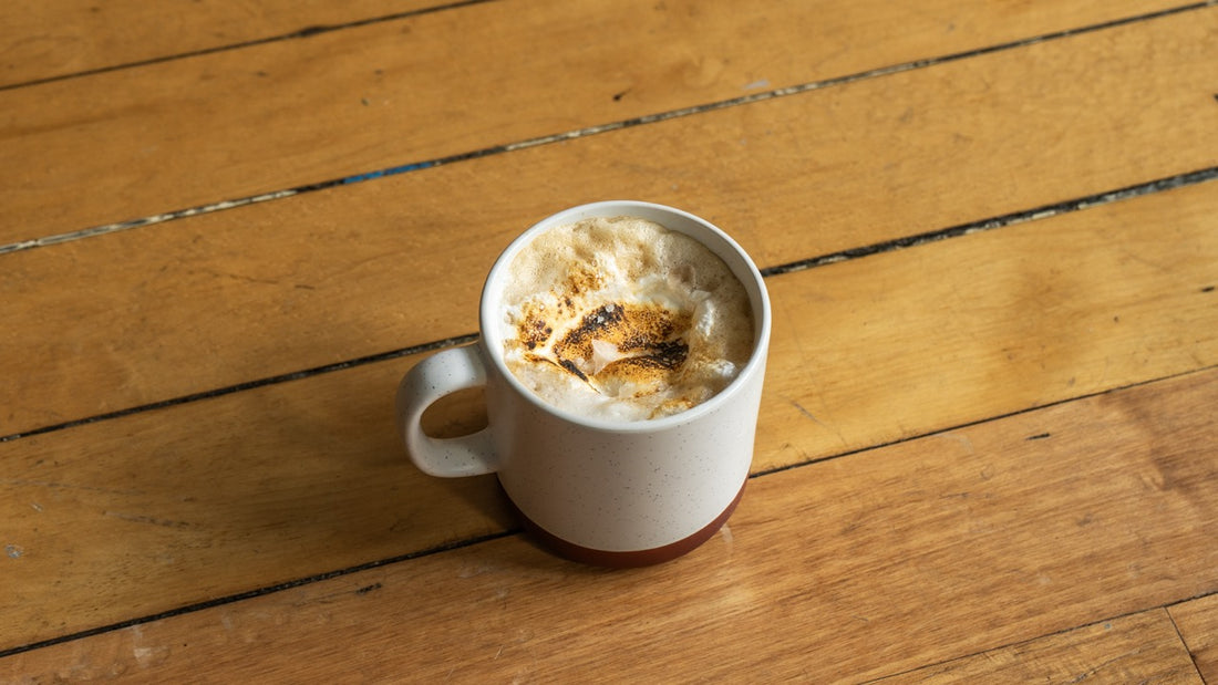 Smore latte in a ceramic mug on a wooden table