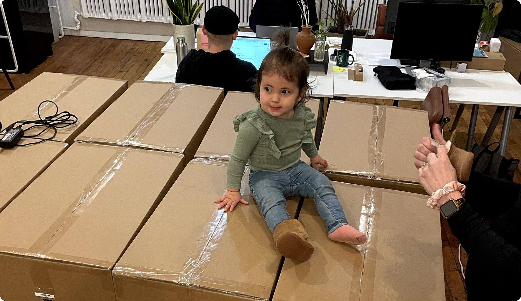 Terra Kaffe | Infant child sitting on boxes
