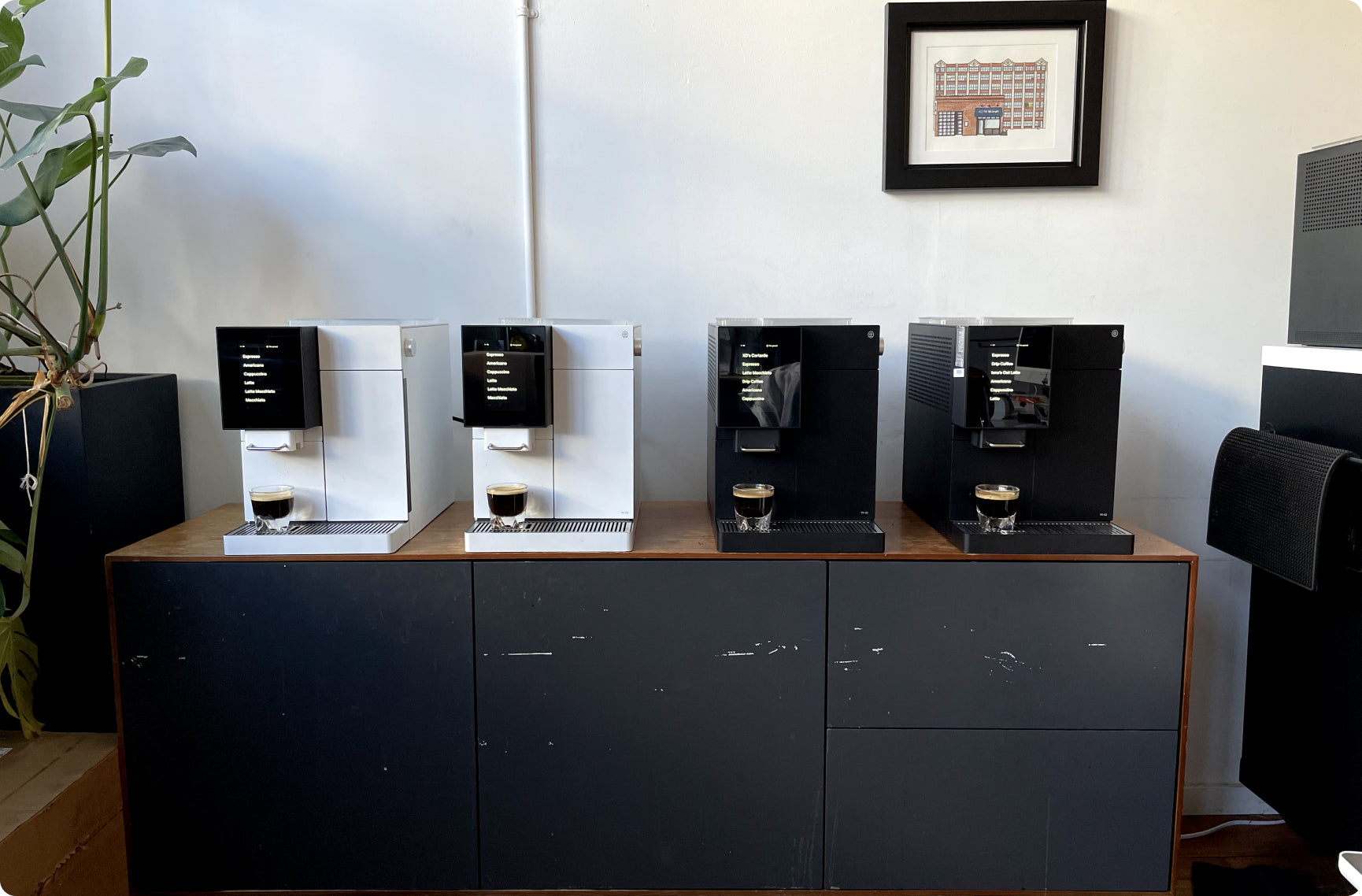 Terra Kaffe | 2 white TK-02 and 2 black TK-02s on a credenza