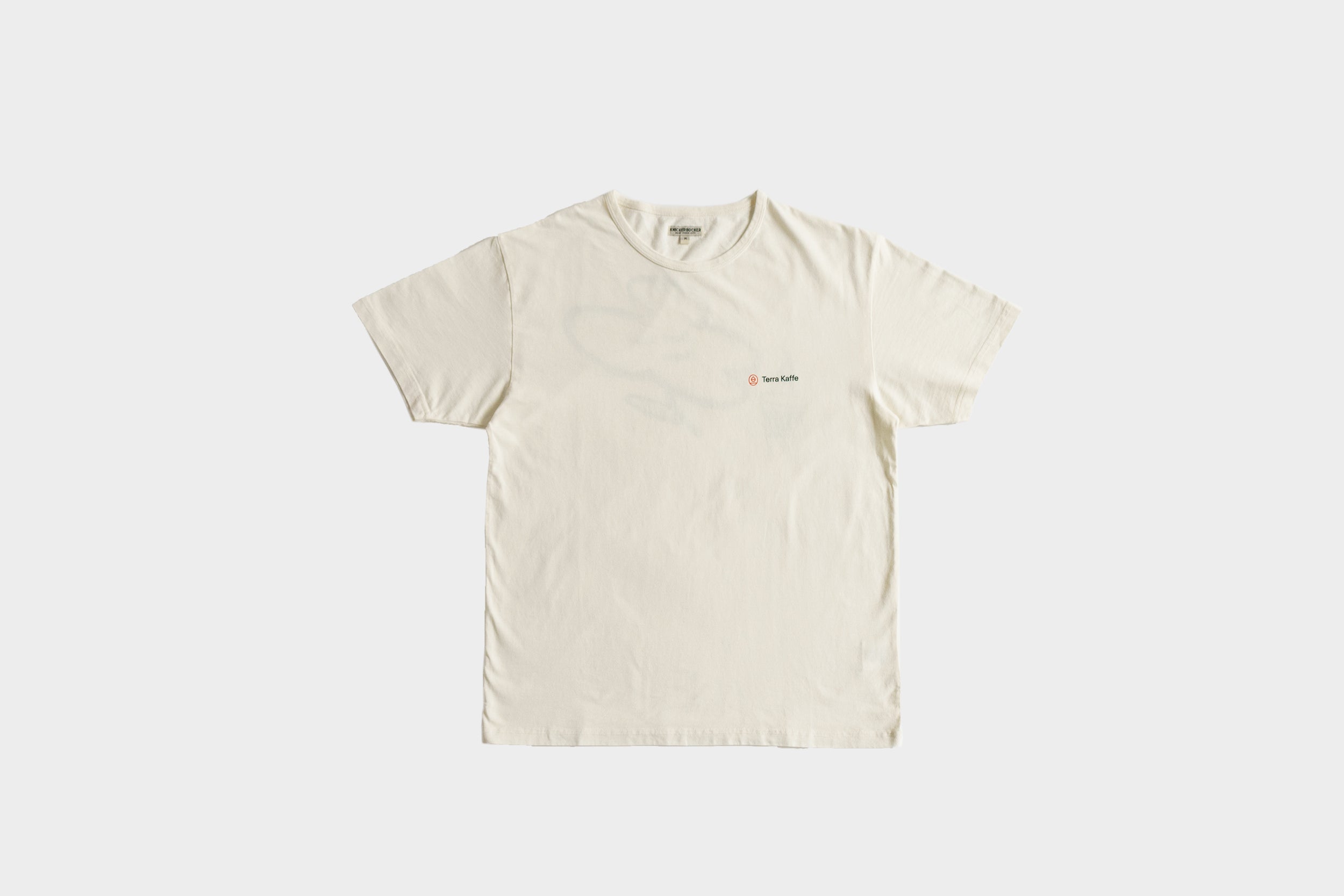 Terra Kaffe | White T-shirt with the Terra Kaffe logo in the top right corner